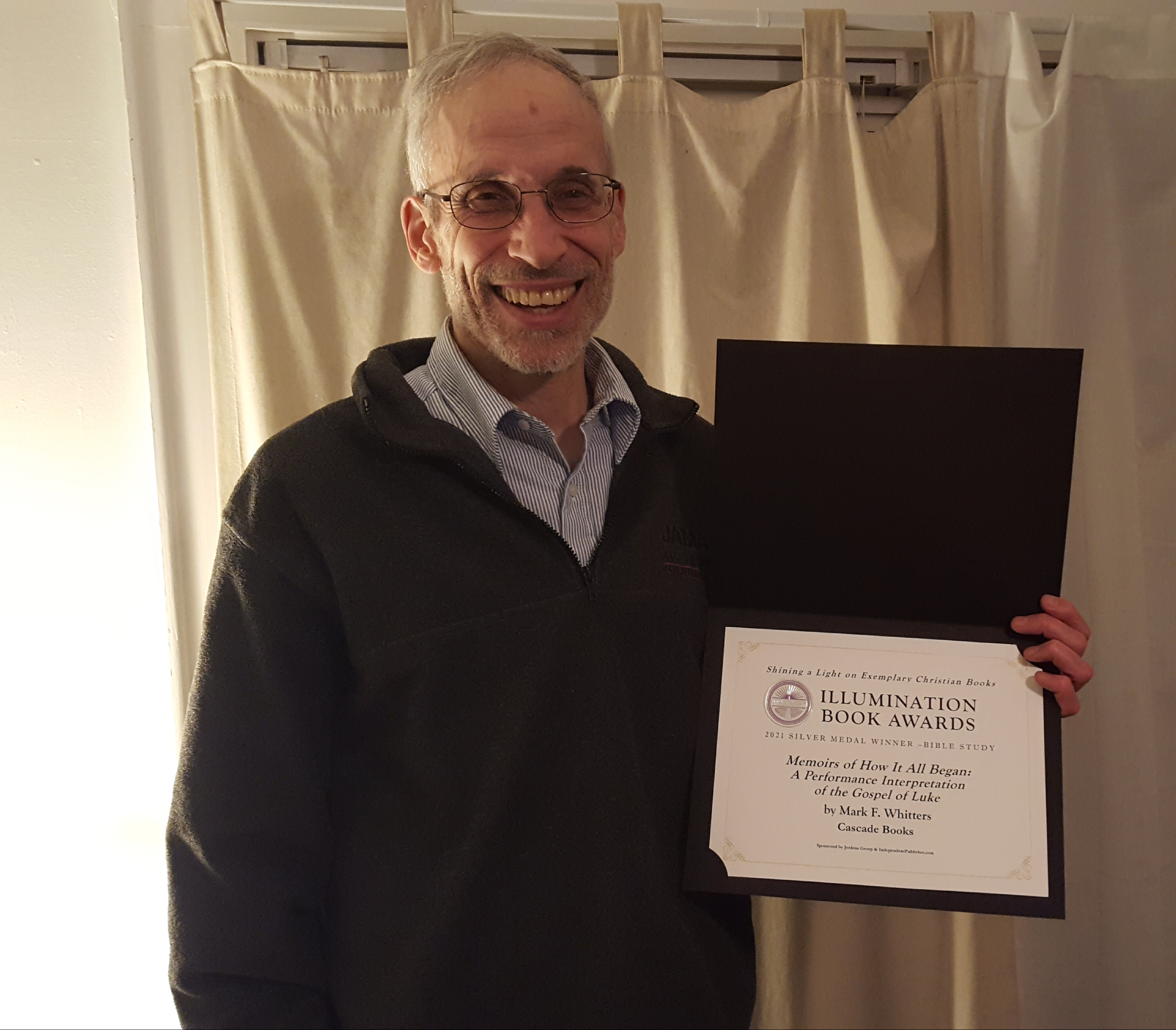 Mark holding the award